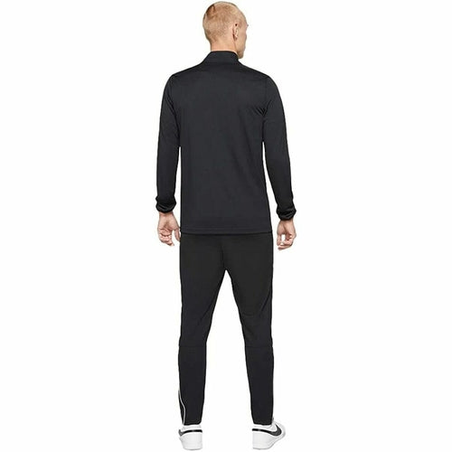 Person wearing a black tracksuit, Man wearing a black Nike tracksuit, Nike, tracksuit, F1 merch, winter exercise clothes, men jersey, mens track pants, adidas, Ferrari, Lamborghini,  motogp, brand clothes
