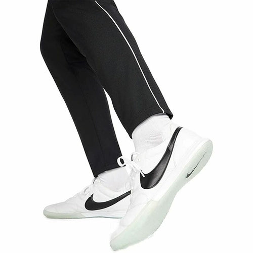 White sneakers with black swoosh logo worn with black pants, Man wearing a black Nike tracksuit, Nike, tracksuit, F1 merch, winter exercise clothes, men jersey, mens track pants, adidas, Ferrari, Lamborghini,  motogp, brand clothes